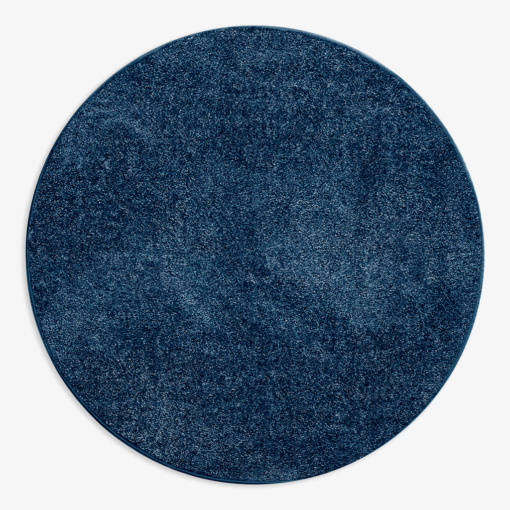 Dywan okrągły ciemnoniebieski CLEVER 130 cm wykonany z przędzy polipropylenowej. 
