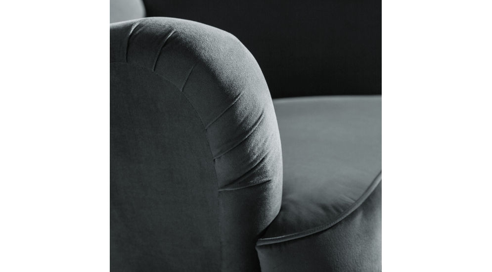 Fotel uszak w szarej welurowej tkaninie na czarnych nóżkach - detal
