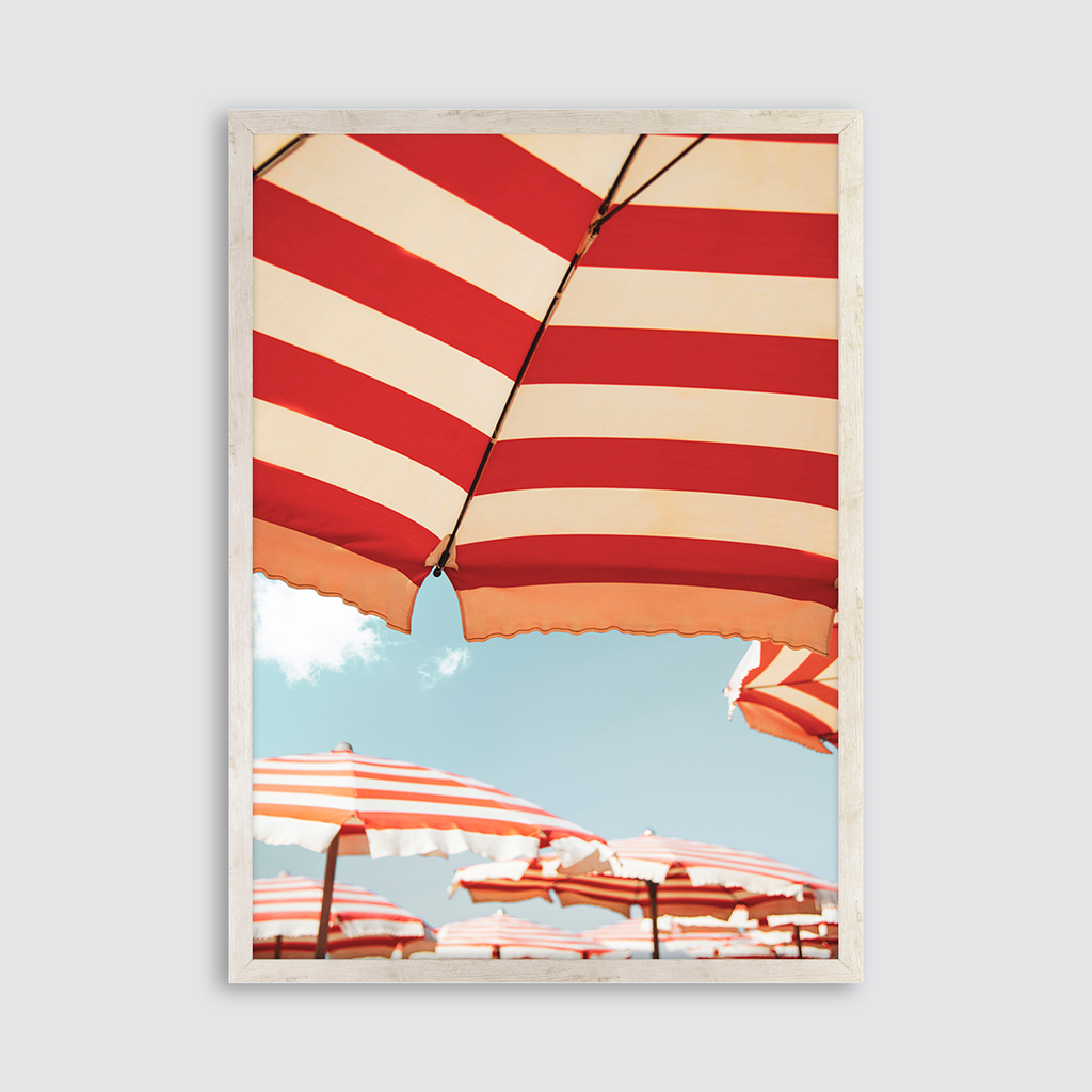 Obraz z grafiką z kolorowych parasoli na plaży