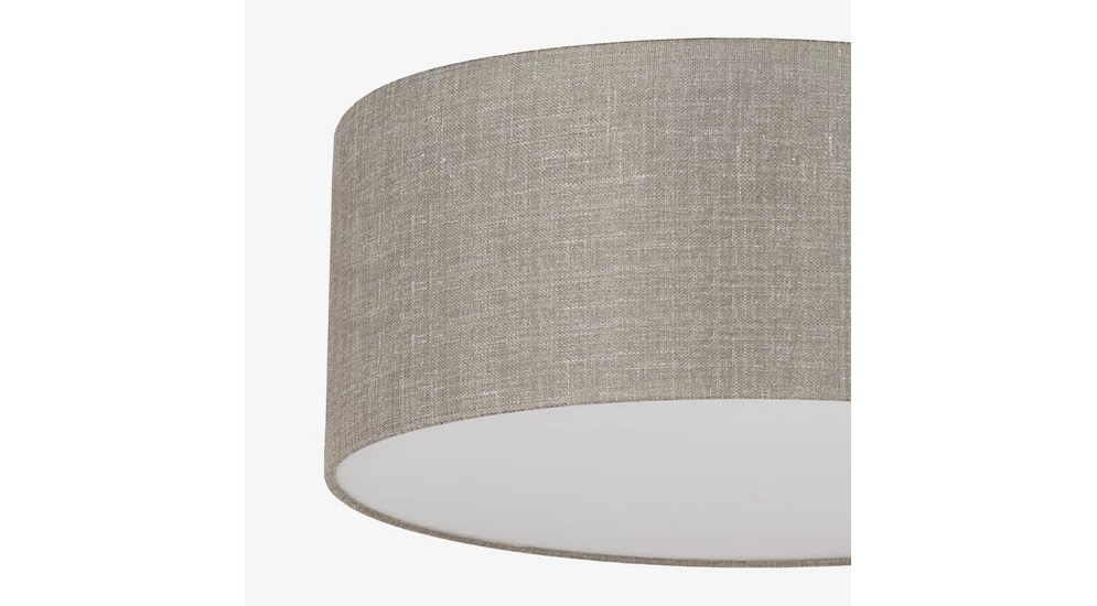 Lampa RONDO LINEN posiada abażur, w którym tkanina została rozpięta na okrągłym stelażu.