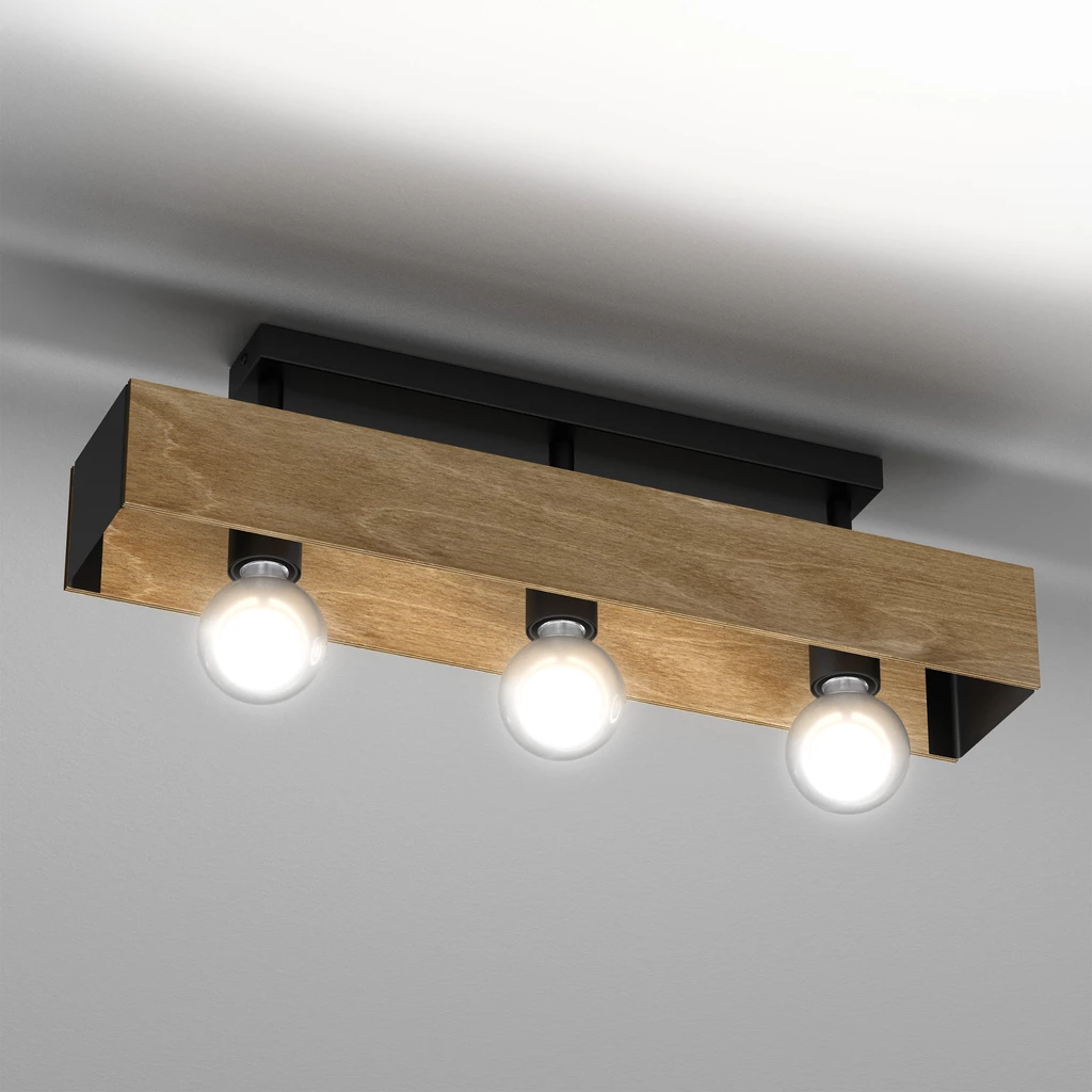 Niecodzienny design lampy wiszącej MILUZA stoi na pograniczu stylów rustykalnego i loftowego. Jej drewniane elementy z charakterystycznymi przebarwieniami i widocznymi słojami wprowadzają do wnętrza element naturalności i zgrabnie komponują się meblami ut